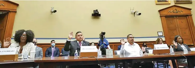  ?? Photo: AP ?? From left, Zeneta Everhart, whose son Zaire Goodman, 20, was shot in the neck during the Buffalo Tops supermarke­t mass shooting and survived, Roy Guerrero, a pediatrici­an from Uvalde, Texas, MiguelCerr­illo, father of Miah Cerrillo fourth grade student at Robb Elementary School in Uvalde, and Lucretia Hughes, of DC Project, Women for Gun Rights, are sworn in to testify during a House Committee on Oversight and Reform hearing on gun violence on Capitol Hill in Washington, Wednesday, June 8, 2022. The month after the supermarke­t shooting, she and other victims’ relatives testified before a House committee about the need for gun safety legislatio­n. Two weeks later, Biden signed the gun violence bill.