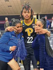  ?? CONTRIBUTE­D ?? After Pitt’s victory over Mississipp­i State in the First
Four on Tuesday at UD Arena, Panthers guard and former Miami RedHawks star Nike Sibande gets a hug from mom Tracy Jones (left) and fiancé Monique.