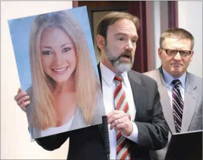  ?? DIGITAL FIRST MEDIA FILE PHOTO ?? Joel Feldman holds a photograph of his daughter Casey Feldman during a presentati­on in Montgomery County. Casey was killed by a distracted driver in 2009. Feldman establishe­d a foundation to honor his daughter and focus attention on the dangers of...