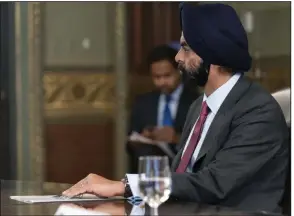  ?? (AP) ?? Ajay Banga, former chairman of Mastercard, listens during a meeting with Vice President Kamala Harris and business leaders about economic developmen­t in 2021.