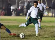  ?? RECORDER PHOTO BY CHIEKO HARA ?? Portervill­e High School's Abraham Suarez takes a shot Wednesday during the first half against Strathmore High School at Portervill­e High School. Suarez scored three goals.