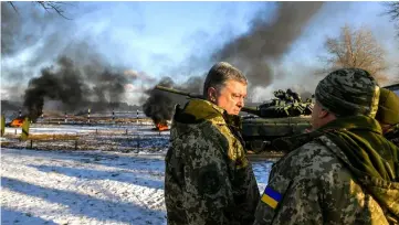  ??  ?? Poroshenko visits the 169th training centre ‘Desna’ of the Ukrainian Army ground forces in Chernihiv Region, Ukraine. — Reuters photo