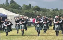  ?? ?? Mid Argyll Pipe Band playing outside last year at the Dalmally Show, led by Pipe Major Stephen Clark, left.