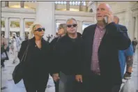  ?? The Associated Press ?? GRIEVING: Charlotte Charles, left, mother of British teenager Harry Dunn, and her husband Bruce Charles, center arrive at Union Station in Washington on Tuesday.