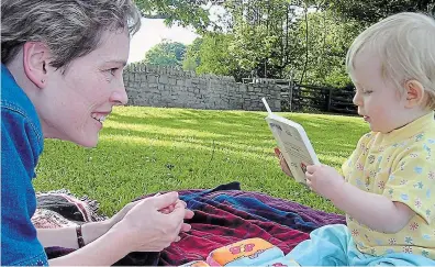  ?? THOMAS FROESE PHOTO ?? In this 2004 photo, Liz Froese, daughter of Thomas Froese, enjoys a book with her mother, Jean Chamberlai­n Froese. With World Book Day around the corner, it’s a good time to consider how stories nourish the human spirit, Thomas Froese writes.