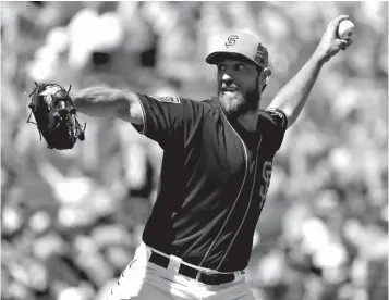  ?? Associated Press ?? ■ San Francisco Giants starting pitcher Madison Bumgarner throws against the Kansas City Royals during the first inning of a spring baseball game Friday in Scottsdale, Ariz.