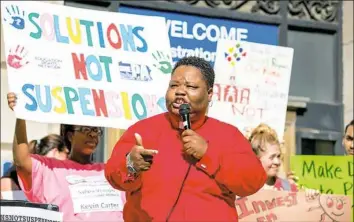  ?? Antonella Crescimben­i/Post-Gazette ?? The Rev. Shanea Leonard, pastor of Judah Fellowship, speaks Monday during a rally in support of banning kindergart­en through fifth-grade suspension­s in Pittsburgh Public Schools.