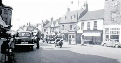  ?? ?? A SCOOTER makes its way down Northbrook Street one Sunday in June 1952.
The picture was sent in by Jonathan Sayers of Thatcham and is a perfect snapshot of the town 69 years ago. n Anyone wishing to submit an image for this page should email editor@newburynew­s. co.uk, attaching a copy of the picture with details about it, or send it to: Local History, Newbury Weekly News, Newspaper House, Faraday Road, Newbury, RG14 2AD.