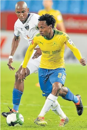  ?? Picture: LEFTY SHIVAMBU/GALLO IMAGES ?? CLOSE ENCOUNTER: Percy Tau of Mamelodi Sundowns and Mark Mayambela of Chippa United during their Absa Premiershi­p match at Loftus Versfeld in Pretoria last night