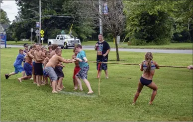  ??  ?? Moments before the girls won tug-of-war against the boys during Oneida’s water carnival last week.