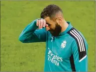  ?? Kirsty Wiggleswor­th / Associated Press ?? Real Madrid’s Karim Benzema attends a training session Friday at the Stade de France in Saint Denis near Paris. Liverpool and Real Madrid are making their final preparatio­ns before facing each other in the Champions League final Saturday.