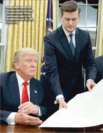  ?? EVAN VUCCI/ AP ?? Former White House Staff Secretary Rob Porter hands President Donald Trump a confirmati­on order in the Oval Office on Jan. 20, 2017.