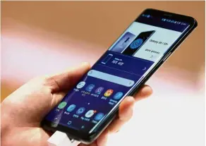  ?? — Bloomberg ?? Most new Samsung smartphone­s, including the Galaxy S9, allow you to take a screenshot with a hand gesture.