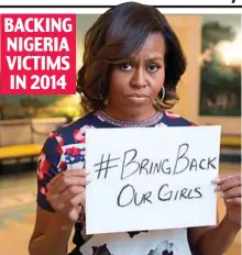 ?? ?? Slogan: Michelle Obama’s fears for Africa captives BACKING NIGERIA VICTIMS IN 2014