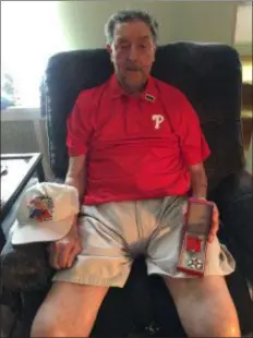  ?? PEG DEGRASSA - MEDIANEWS GROUP ?? WWII U.S. Army Veteran Jack Callahan, 94, relaxes at his Glenolden home, displaying some of the medals that he recently received recognizin­g his military service after 75 years.