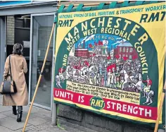  ?? ?? ‘Rise like lions’: at Manchester Victoria station an RMT banner of Peterloo quotes Shelley