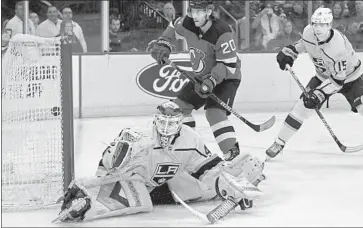  ?? Bill Kostroun Associated Press ?? CAL PETERSEN stopped two breakaways and made 31 saves in his season debut Saturday for the Kings.