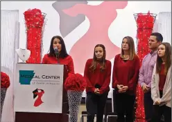  ?? Caitlan Butler/News-Times ?? Speakers: The Bonsall family was presented with a gift from the Medical Center of South Arkansas at yesterday’s Go Red Luncheon. Pictured left to right are Sarah Teague, Marleigh Bonsall, Amanda Bonsall, Craig Bonsall and Madilyn Bonsall.