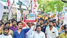  ??  ?? DYFI members stage an agitation demanding justice for Fathima Lathief at Shastri Bhavan on Thursday