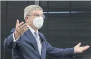  ?? AFP ?? IOC president Thomas Bach gestures as he arrives at a meeting with Tokyo 2020 chief Seiko Hashimoto yesterday.