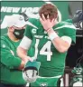  ?? Andrew Mills / Associated Press ?? New York Jets quarterbac­k Sam Darnold (14) puts on a cap after he threw an intercepti­on, his second of the game, in the fourth quarter against the Miami Dolphins on Sunday in East Rutherford, N.J.