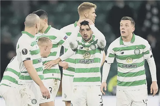  ??  ?? 2 Celtic players look stunned after their
3-1 defeat by Copenhagen at Parkhead as they crashed out of the Europa League at the last-32 stage for the third year in a row.