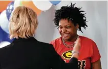  ??  ?? Sherry Dunlap presents a $500 scholarshi­p to Spring High School senior Nadiya Taylor during ceremonies on Tuesday.