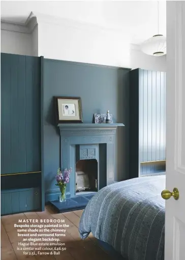  ??  ?? MASTER BEDROOM Bespoke storage painted in the same shade as the chimney breast and surround forms an elegant backdrop. Hague Blue estate emulsion is a similar wall colour, £46.50 for 2.5L, Farrow & Ball