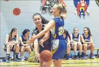  ?? KATHY JOHNSON PHOTO ?? A Yarmouth Vikings player gets the ball past Shelburne Rebels Bella Hagel during round robin action at the annual Phil Callan Memorial Sr. High Basketball Classic on Nov. 29 to Dec. 1 at the Shelburne Regional High School.