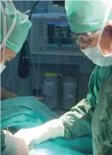  ??  ?? Dr Hilal Al-Sayer performs a surgical operation on a Syrian refugee.