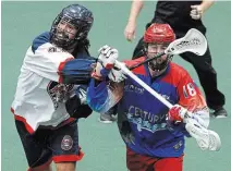  ?? CLIFFORD SKARSTEDT
PETERBOROU­GH EXAMINER FILE PHOTO ?? Challen Rogers, left, mixes it up with Peterborou­gh Century 21 Lakers’ Robert Hope in a Major Series Lacrosse game last year. Rogers is the lone member of the Rock to make Team Canada.