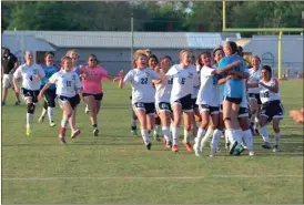  ?? LARRY GREESON / For the Calhoun Times ?? The Calhoun girls celebrate after defeating Sonoravill­e 4-3 in penalty kicks on Thursday in a crucial Region 6-AAA contest.