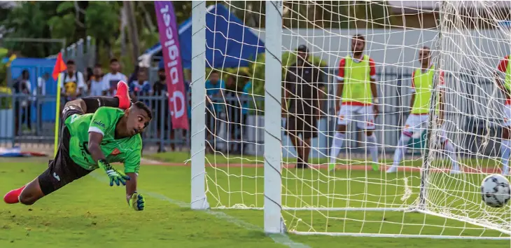  ?? Photo: Leon Lord. ?? Glamada Investment­s Rewa goalkeeper Mohammed Alam fails to stop a classic strike from 4R Electrical Labasa striker Christophe­r Wasasala in their Digicel Fiji FACT clash at the ANZ Stadium, Suva, on May 22, 2022. Labasa won 2-1.