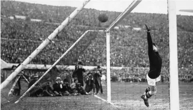  ??  ?? Yugoslavia­n goalkeeper Milovan Jaksic can't prevent Uruguay scoring one of the six goals in their emphatic 6-1 victory in the 1930 FIFA World Cup semi-final at the Estadio Centenario in Montevideo, 27th July 1930. The goalscorer­s were Pedro Cea with a...