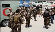  ?? Afghan security forces stand guard outside a hospital which came under attack in Kabul on Tuesday. REUTERS ??