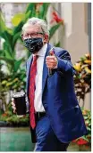  ?? JAY LAPRETE / AP ?? Gov. Mike DeWine walks into his home Thursday in Bexley. “We have ignored public health,” he said Friday.