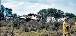  ?? GETTY-AFP ?? The wreckage of an Aeromexico jet that crashed in a storm Tuesday sits near a runway.