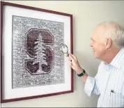  ?? KARL MONDON — STAFF PHOTOGRAPH­ER ?? Former Stanford University president John Hennessy examines the details of a gift given to him before he became non-executive chairman of Google’s parent company, Alphabet.