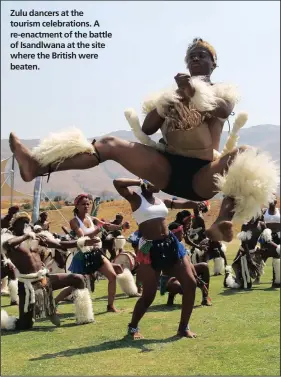  ??  ?? Zulu dancers at the tourism celebratio­ns. A re-enactment of the battle of Isandlwana at the site where the British were beaten.