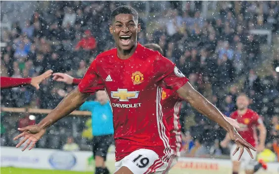  ?? — GETTY IMAGES ?? Manchester United’s Marcus Rashford celebrates after scoring their late winning goal during an English Premier League match against Hull City on Saturday in Kingston upon Hull, England. Manchester United won the game 1-0.