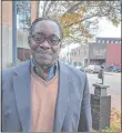  ?? LEE HOWARD/THE DAY ?? George Walker, former drug addict and newly minted Ph.D., stands on Eugene O’Neill Drive in New London last month.