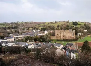  ??  ?? Laugharne in Carmarthen­shire where second home owners don’t have to pay increased council tax. Residents say it is like a ghost town in winter.