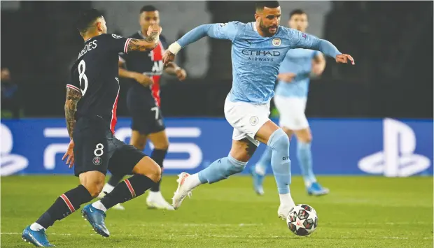  ?? ANNE-CHRISTINE POUJOULAT / AFP VIA GETTY IMAGES ?? Manchester City defender Kyle Walker , right, shown in a match against Paris Saint-germain, recently was targeted for racial abuse on social media
because the perpetrato­r felt like it. The offender acknowledg­ed Walker hadn’t done anything positive or negative in a game against Tottenham.