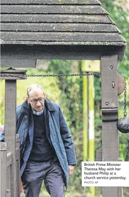  ?? PHOTO: AP ?? British Prime Minister Theresa May with her husband Philip at a church service yesterday.