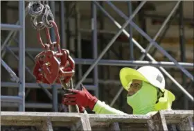  ?? AP FILE ?? A constructi­on worker is shown at the site of a condominiu­m project in Coral Gables, Fla., on June 15, 2017.