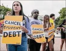  ?? Craig Hudson / For the Washington Post ?? Students and other activists rally against student debt outside the White House on Aug. 25, 2022.