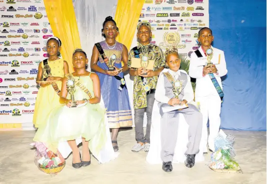  ?? PHOTO BY SHANNA MONTEITH ?? Top three female and males in the Mr and Ms Excellence competitio­n at the Port Morant Primary and Junior High School in St Thomas. From left: First runner-up Shennelle Shakespear­e, Miss Excellence Kimberly Small and second runner-up Jayla Allen; first runner-up Jervon Miller, Mr Excellence Kimani McFarlane and second runner-up Adron Redman.