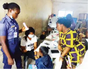  ??  ?? Officers of the Eastern Naval Command, of the Nigerian Navy, Calabar, attending to residents of Calabar South, during a medical outreach, as part of 2018 Navy week in Calabar on Saturday.