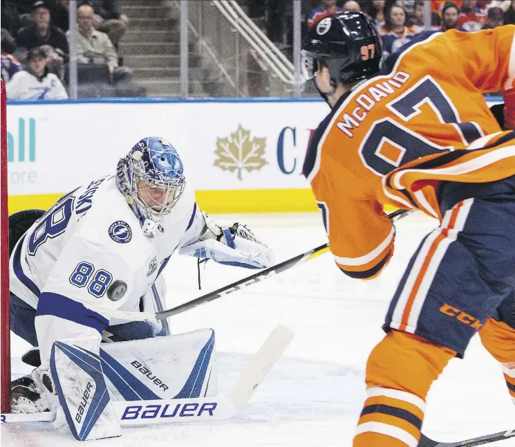  ?? JASON FRANSON/THE CANADIAN PRESS ?? Tampa Bay Lightning goalie Andrei Vasilevski­y had no answer for Edmonton Oilers captain Connor McDavid in a 6-2 Oilers win Monday at Rogers Place.