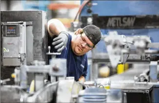  ?? JENN ACKERMAN / THE NEW YORK TIMES ?? Anthony Smith works on the factory floor at Alexandria Industries in Alexandria, Minn., in July. The component manufactur­er, with about 550 employees, is facing a shortage of workers to fill skilled and unskilled positions at the facility roughly two hours north of the Twin Cities.